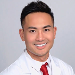 The image is a photo of Derrick Pham, DDS.